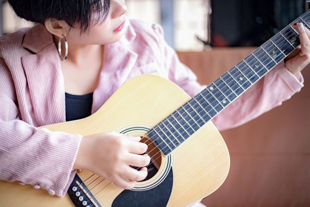 Lady Playing Guitar